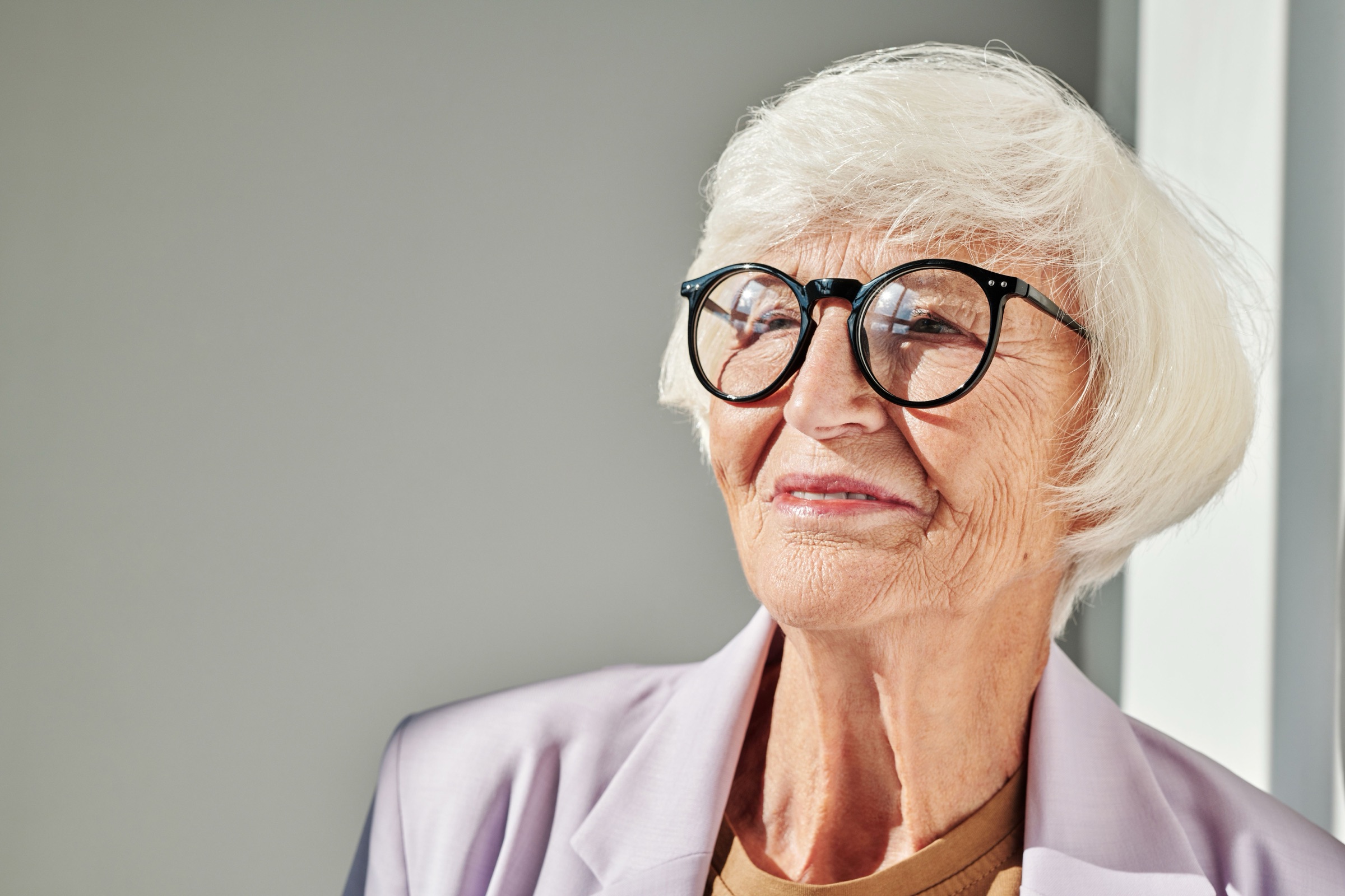 An older woman smiling at home